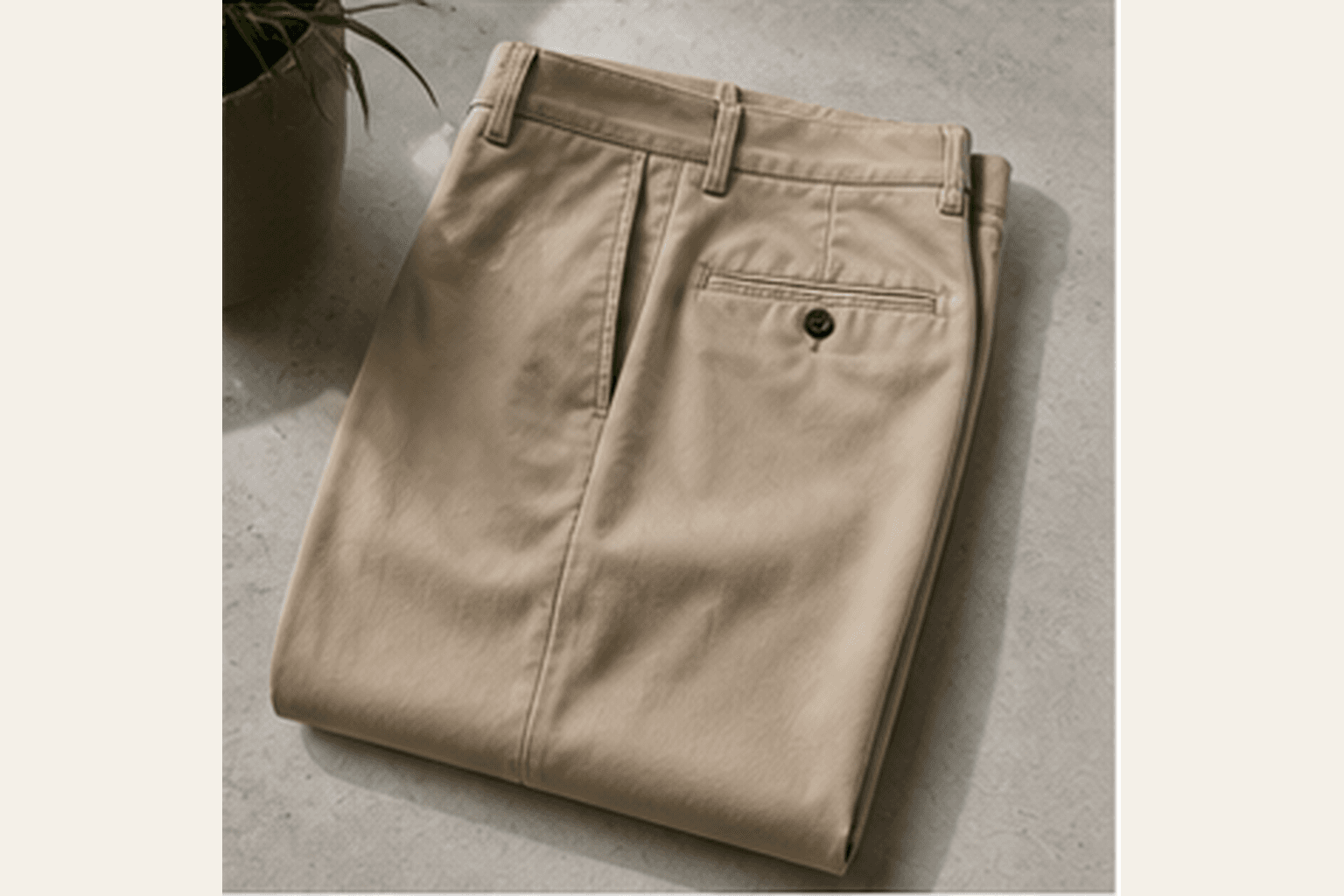 Folded stone cotton trousers with a clean straight silhouette.